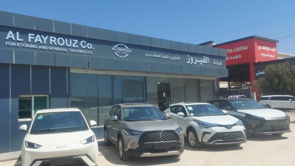 BYD and Toyota units in front of the showroom