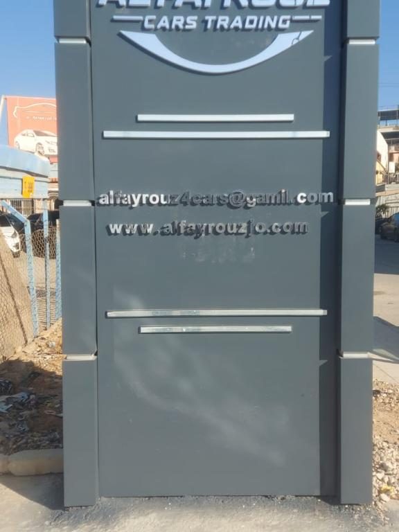 ALFAYROUZ Cars Trading sign (English)